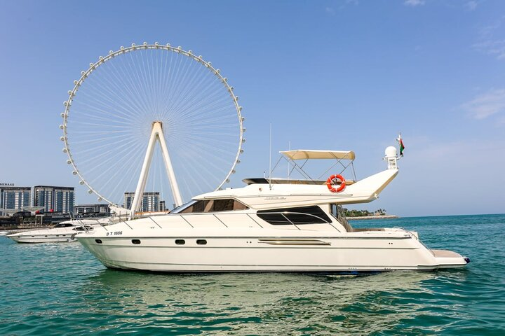 Explore the stunning Dubai coastline aboard a luxurious yacht enjoying delicious food and the company of fellow travelers all while taking in the breathtaking views of iconic landmarks.